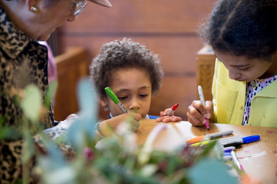 Small editorial team working together at a table